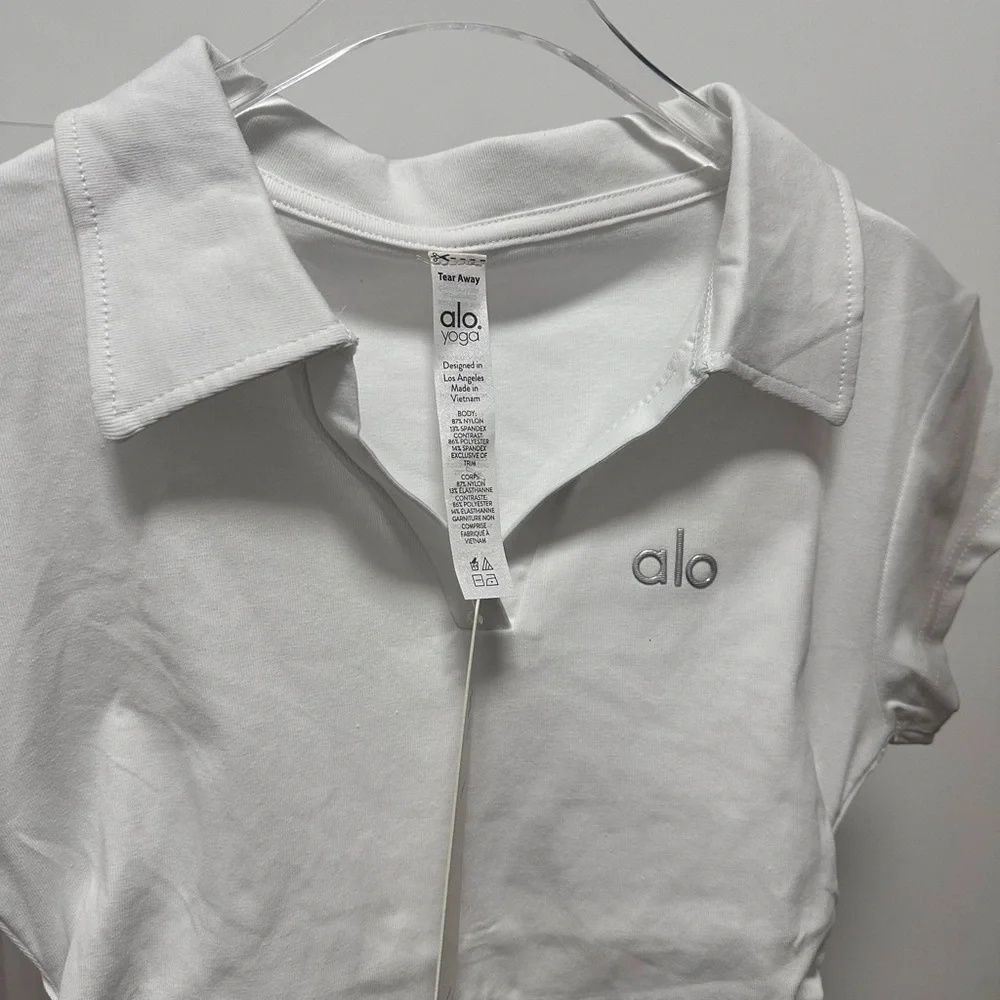 ALO Yoga Women's White Tennis Short Sleeved Top With Pleated Skirt Set